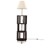 Floor lamp with three tier dark brown bookshelf on a white background