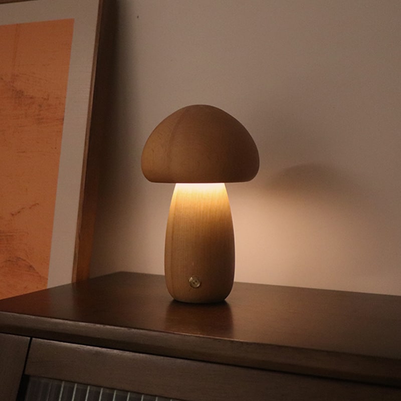Beech wooden mushroom night light glowing on a nightstand, view 1
