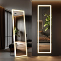 Stowena 70 inch LED full length mirror with rounded corners, one standing on its holder and one wall hung in a dark bedroom