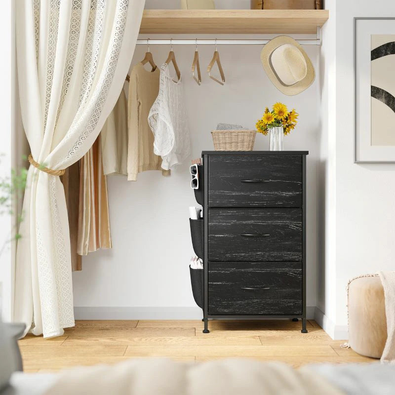 Black nightstand tower used inside a closet with hanging clothes above