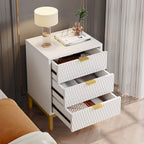 White and gold bedside table with all three drawers open showing books and linens inside