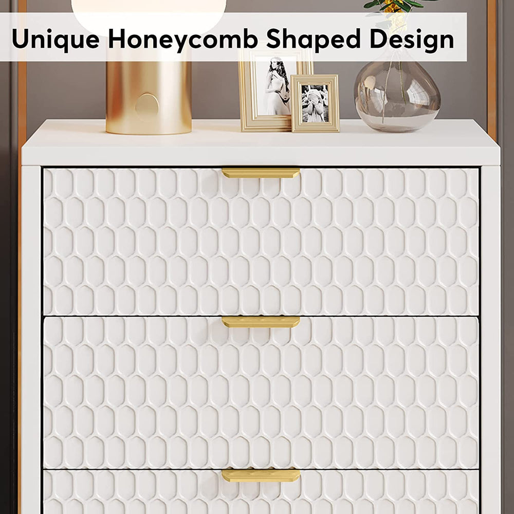 Close-up of the unique honeycomb shaped drawer fronts with gold handles