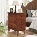 Diamond parquet nightstand beside a bed with a lamp and books