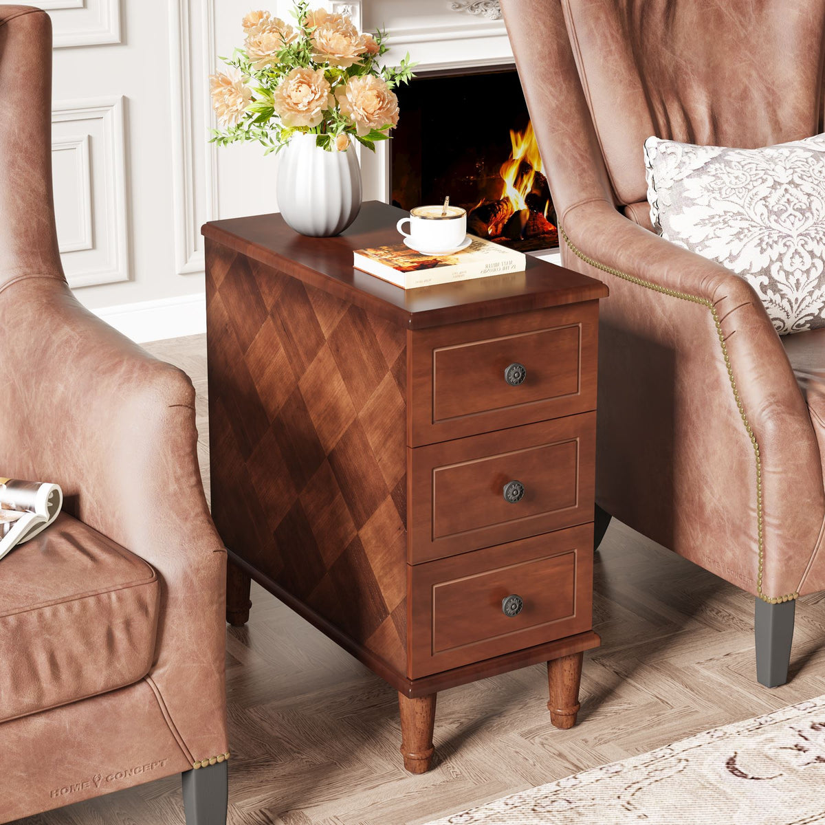 Three drawer side table by a fireplace holding coffee and flowers