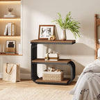 Narrow three tier nightstand against a wall with books and a plant