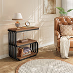 Brown three tier table beside an armchair holding a lamp and books