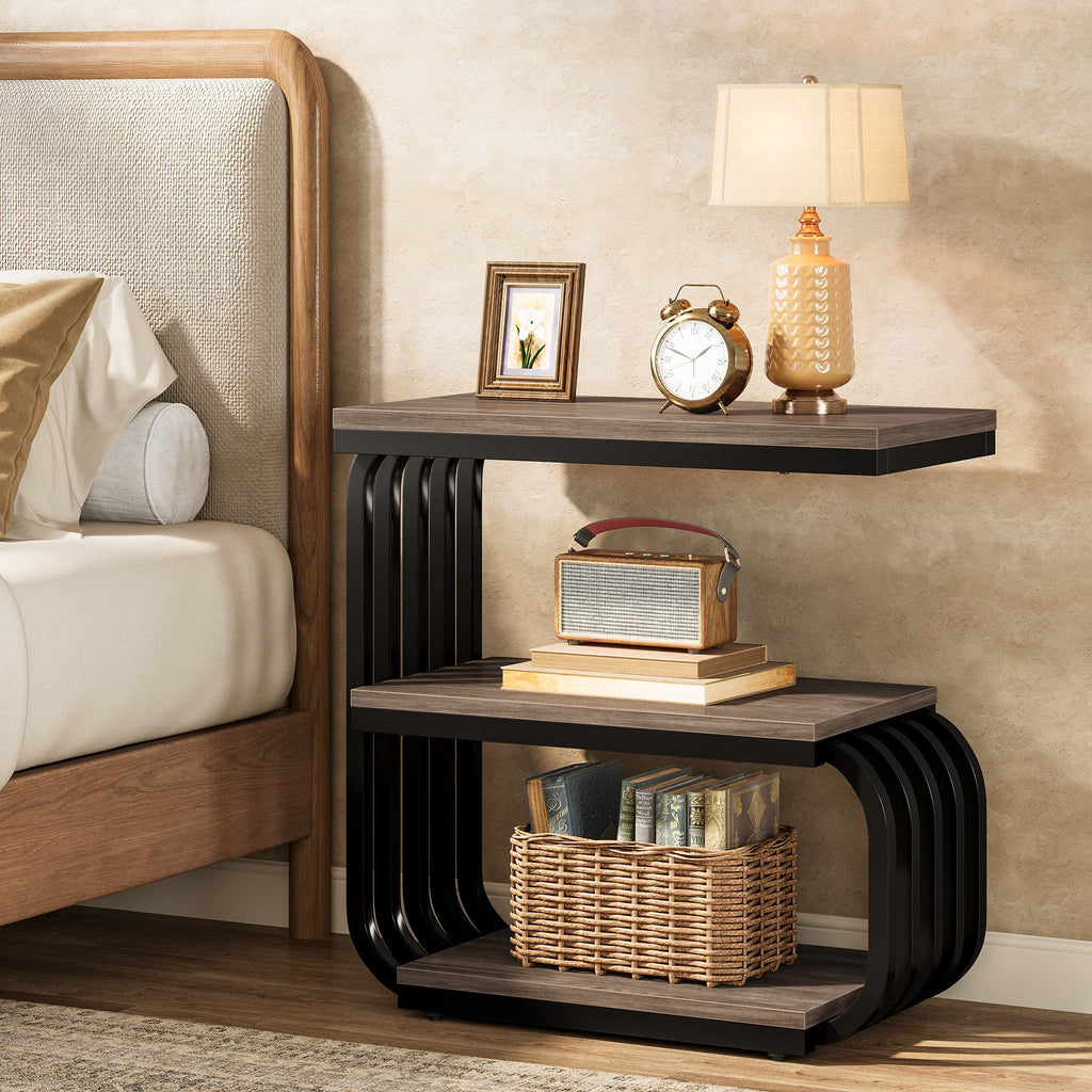 Three tier nightstand with metal frame beside a bed headboard