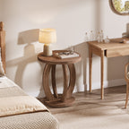 Round table used beside a desk with a small lamp and glasses