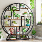 Round eight shelf plant stand in rustic brown holding potted plants against a brick wall