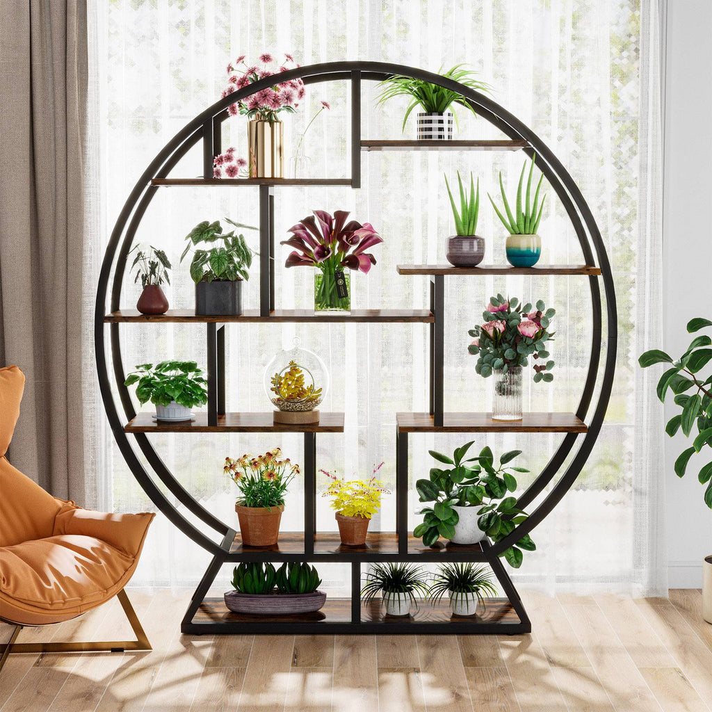 The plant stand beside an armchair with plants on all eight staggered shelves