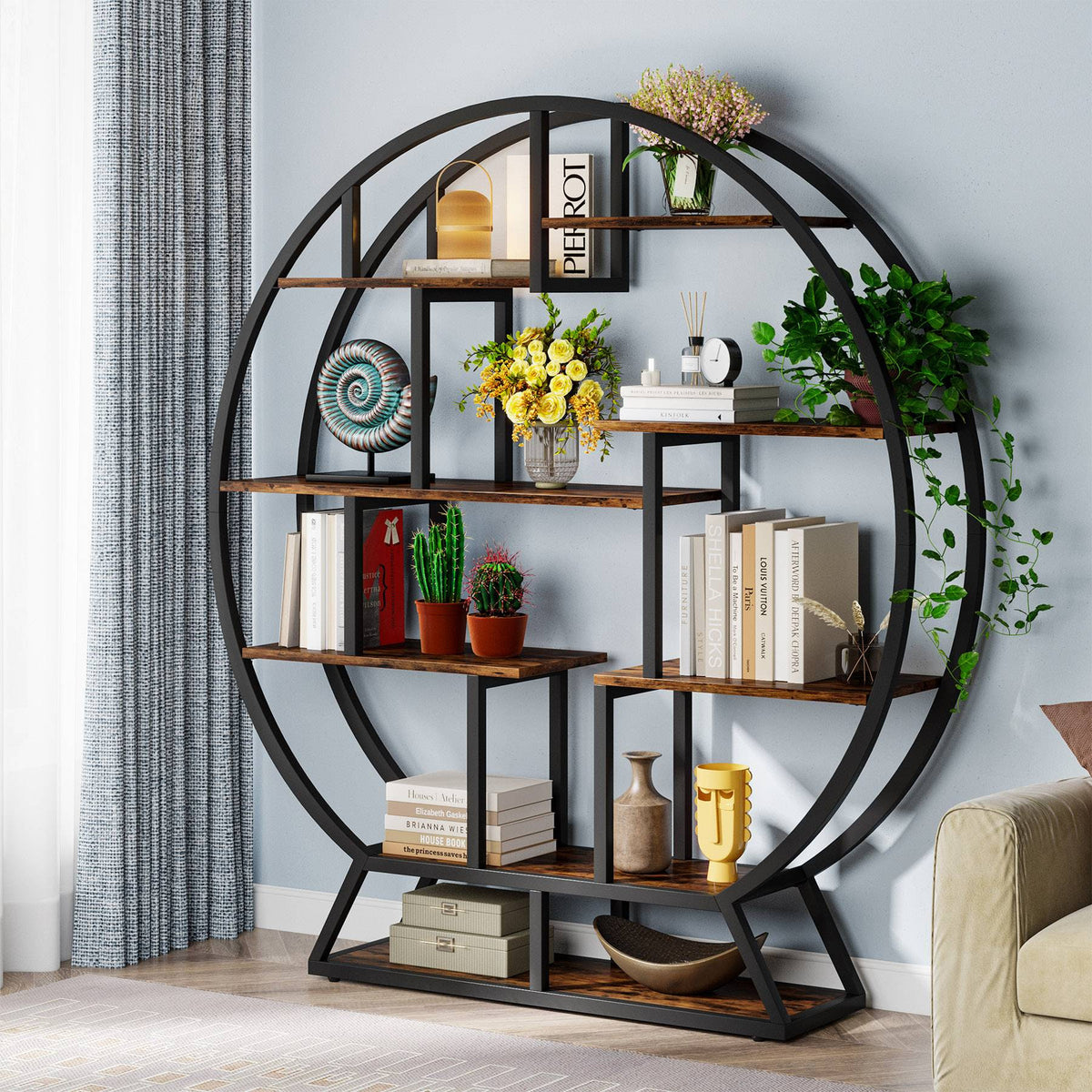The same stand used as a display shelf holding books, vases and ornaments