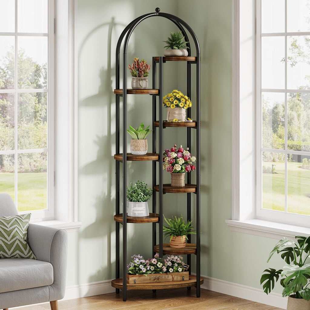 Stowena 8 tier arched plant shelf full of plants by a living room window