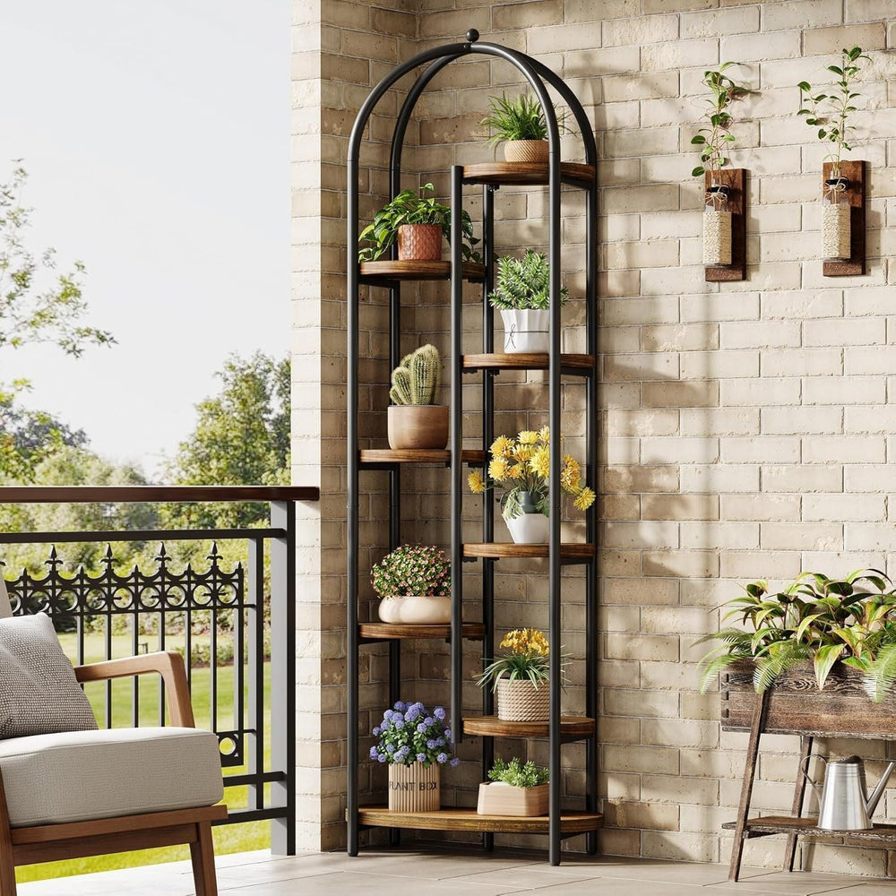 Arched plant stand on a balcony corner with staggered potted plants