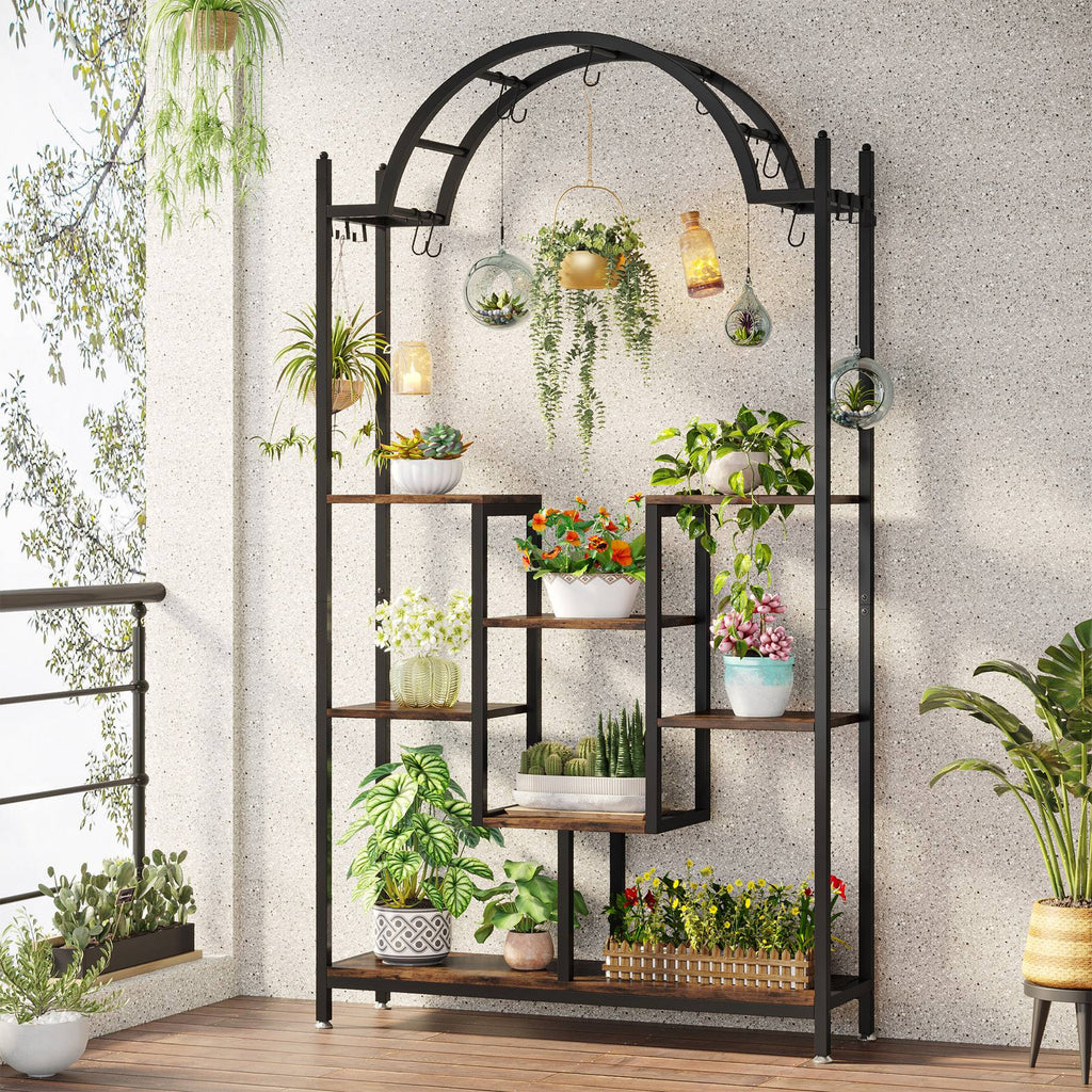 Stowena arched 5 tier plant stand filled with potted and hanging plants