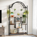 Arched plant stand against a white panelled wall with books and plants