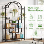 Arched plant rack holding plants, baskets and folders against a bright wall