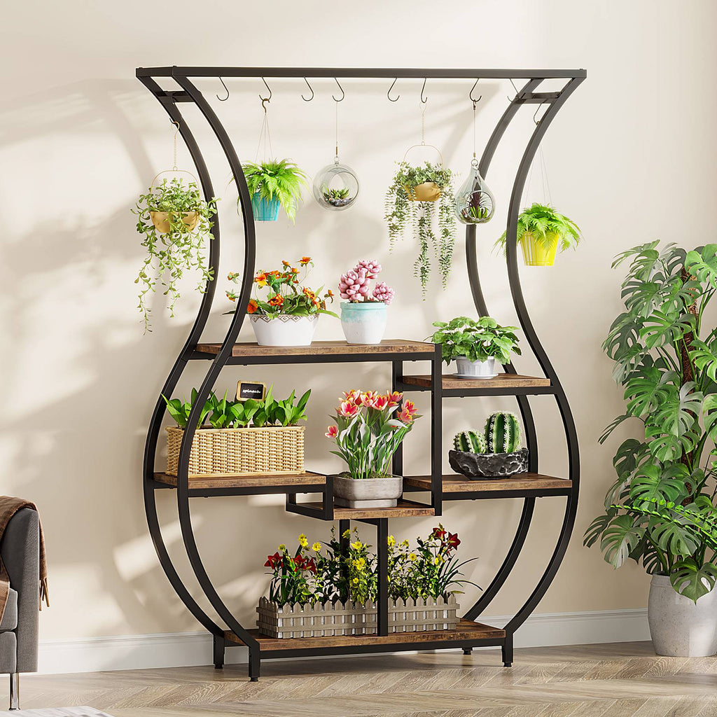Stowena vase shaped 6 tier plant stand filled with potted and hanging plants
