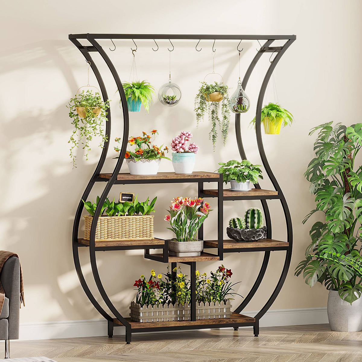 Stowena vase shaped 6 tier plant stand filled with potted and hanging plants