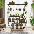 Plant rack in front of a window with hanging pots along the top rail