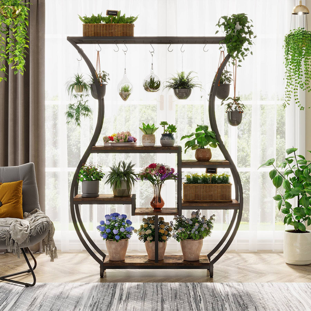 Plant rack in front of a window with hanging pots along the top rail