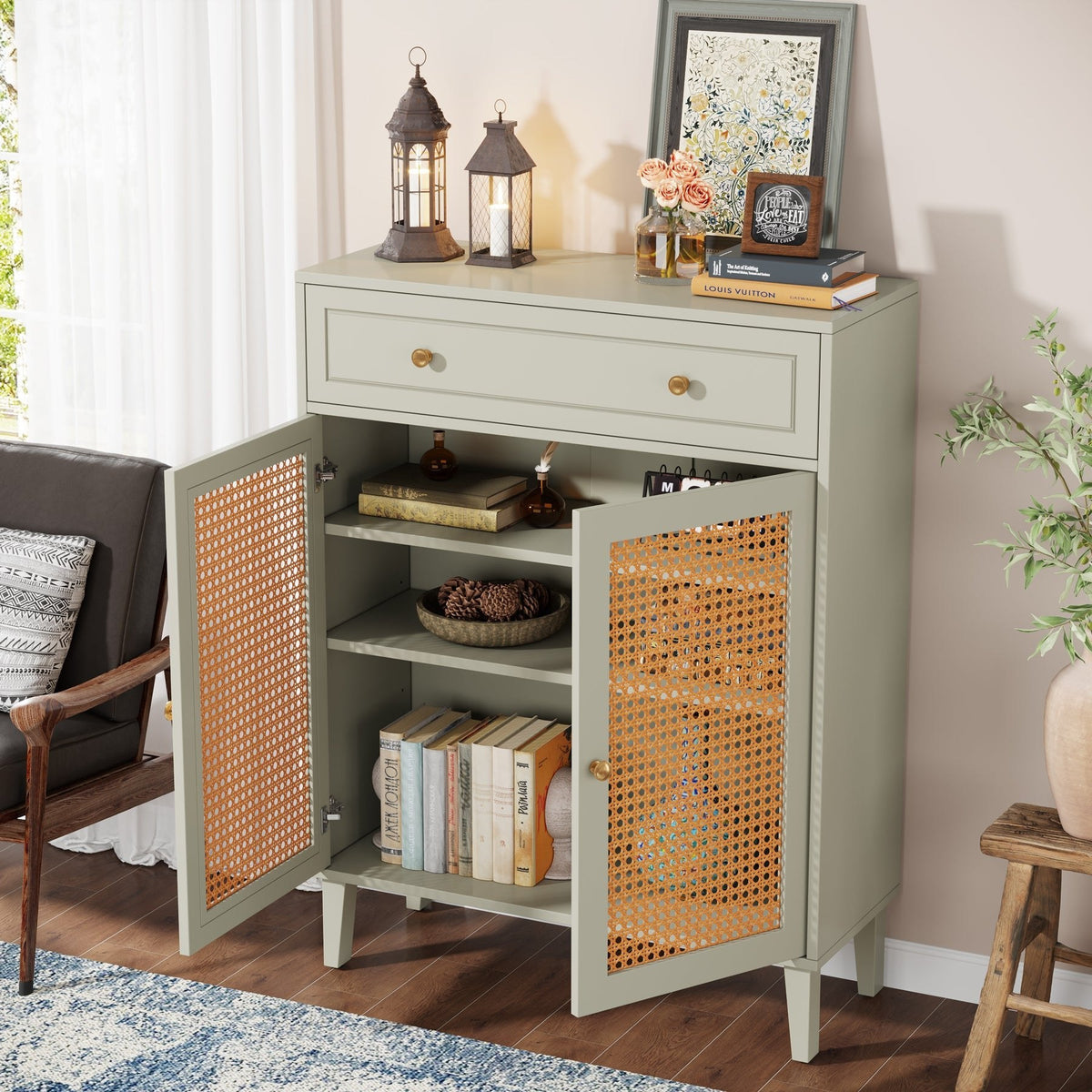 Rattan door cabinet with doors open showing adjustable shelves, books and baskets inside
