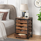 Five drawer rolling chest used as a bedside table with the lowest drawer open
