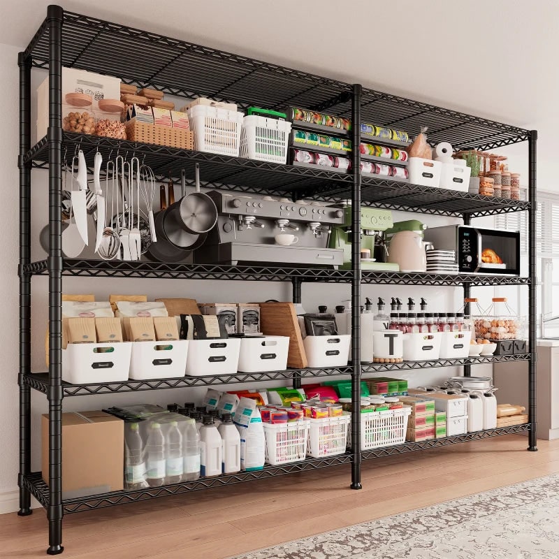 Black wire shelving unit along a kitchen wall holding cookware, baskets, a microwave and pantry stock