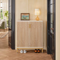 Stowena 20 pair shoe cabinet in white with natural doors styled with a lamp in an entry
