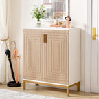 White and natural shoe cabinet with gold legs holding flowers by the front door