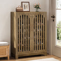Stowena 6 tier shoe cabinet with louvered doors in oak tone with a bag and picture frame on top
