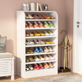 Stowena 8 tier white wooden shoe rack fully loaded beside a white cabinet