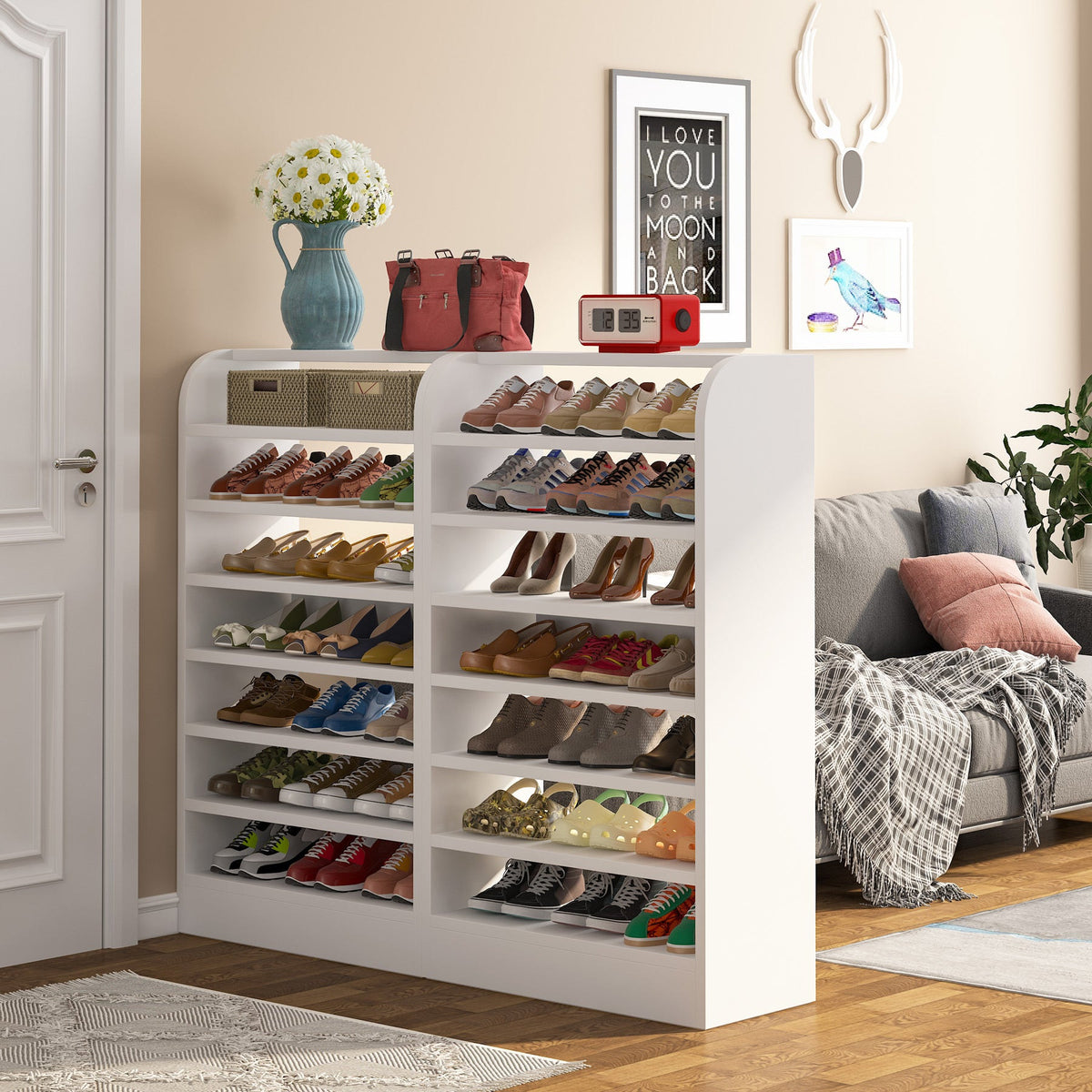 Tall shoe rack beside a sofa holding the household rotation