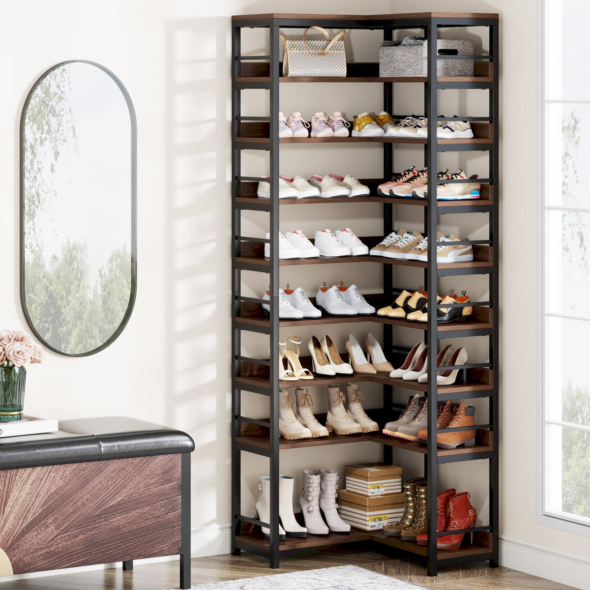 The corner shoe rack in a hallway beside a mirror, stocked with trainers and boots