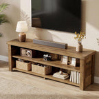 Low farmhouse media console under a wall-mounted TV with baskets and books