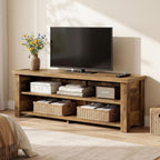 Media console styled with plants and a TV in a bright living room