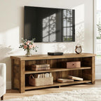 55 inch media console holding a TV beside a sofa