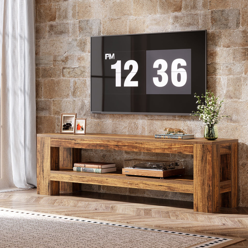 Stowena 59 inch media TV console in warm rustic grain with a large TV against a stone wall