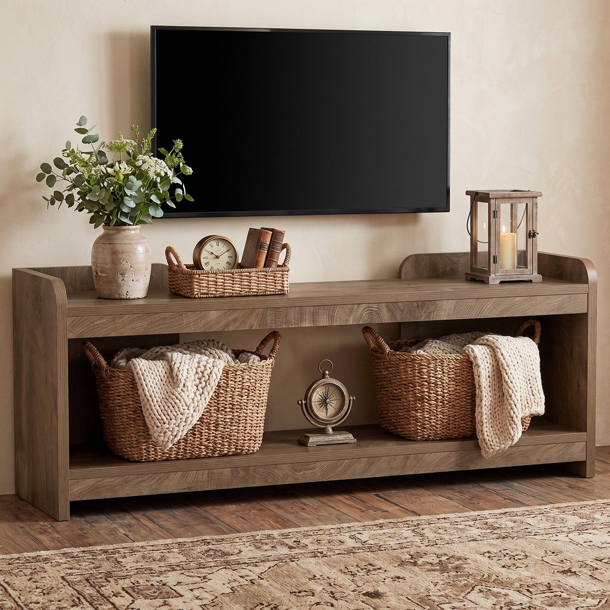 Stowena 63 inch TV stand with a 65 inch TV, baskets and books on the 2 open tiers