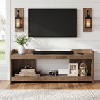 63 inch TV console under a wall-mounted TV with a soundbar on the top shelf