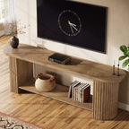 Fluted column detail on the oval TV stand with a basket and books