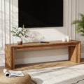 Stowena 63 inch solid wood TV stand with a TV and flowers in a bright living room