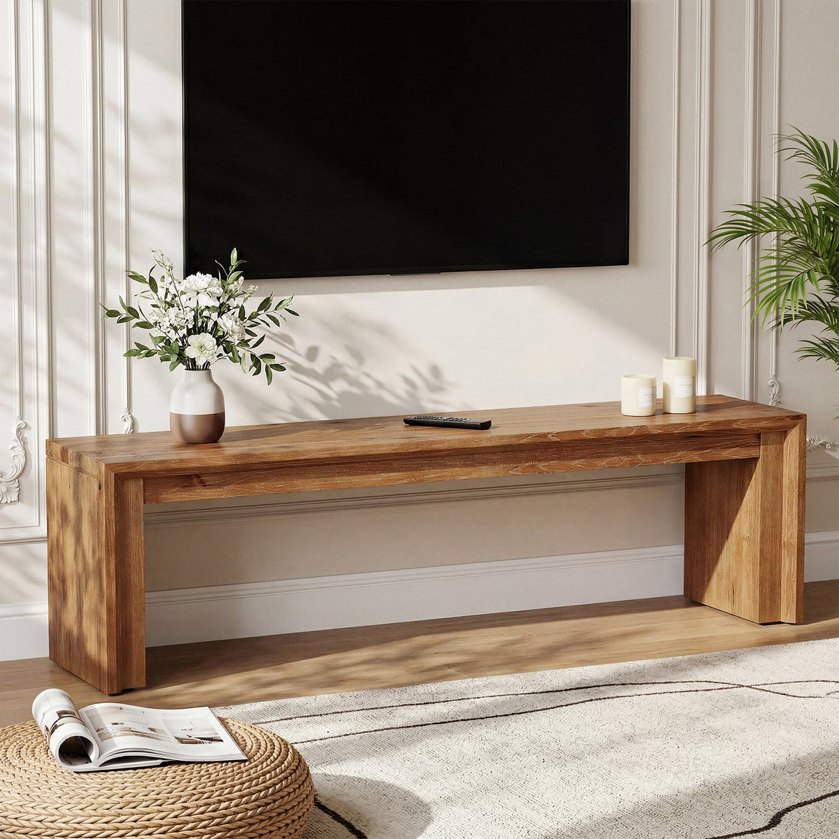 Stowena 63 inch solid wood TV stand with a TV and flowers in a bright living room