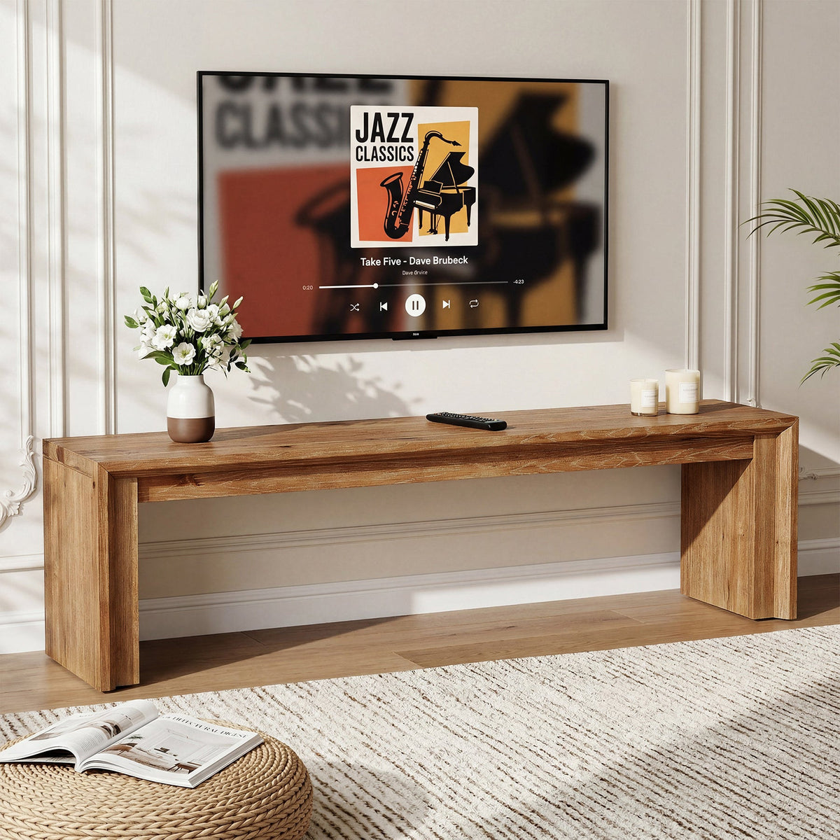 Low solid wood TV bench holding a TV with open shelf storage below