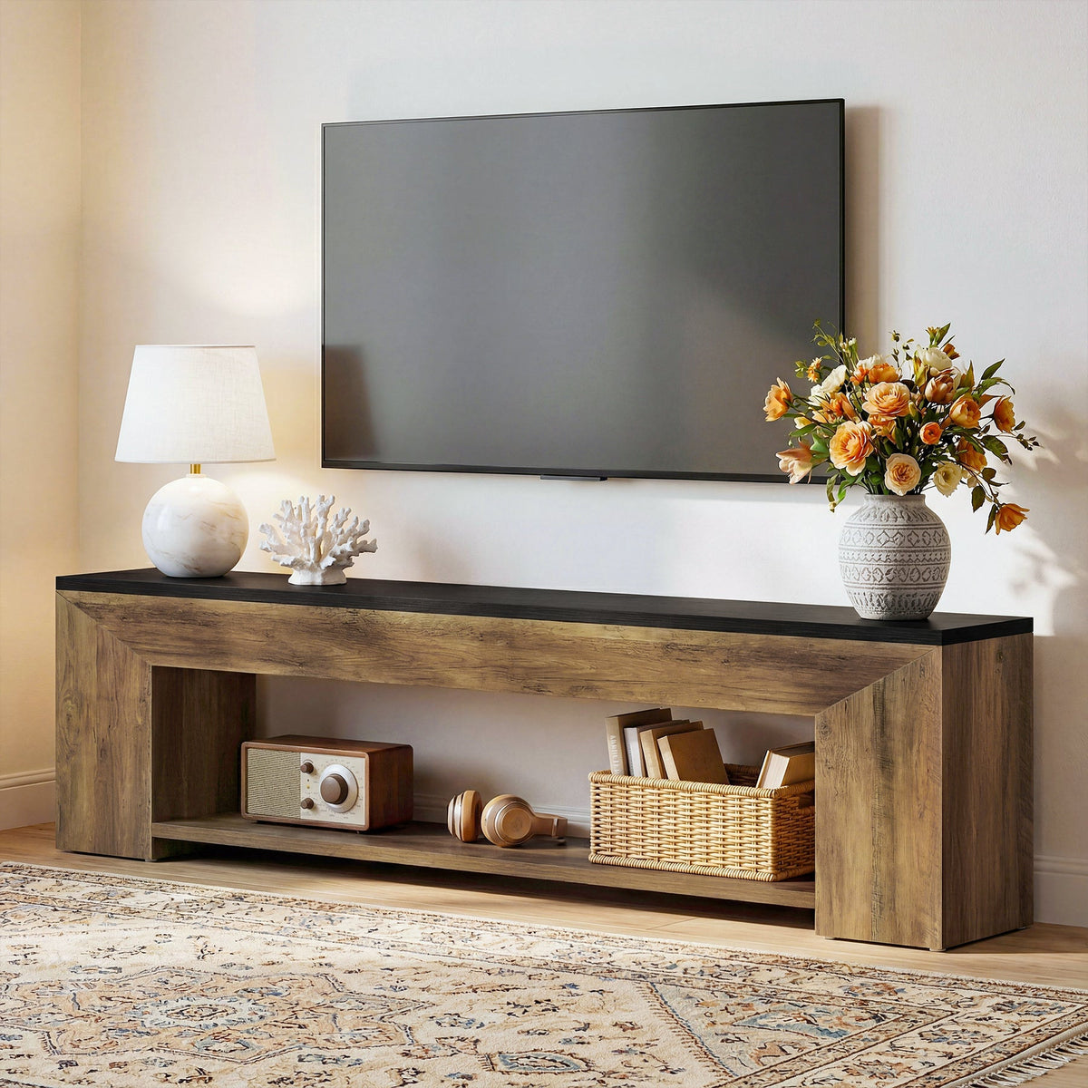 Stowena 70.86 inch extra long TV stand with a large TV, lamp and flowers on top