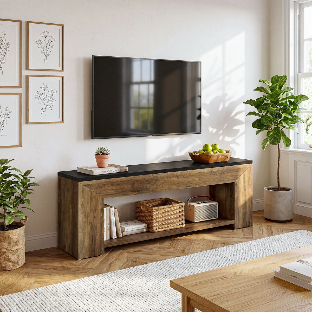 Warm brown TV stand with black top holding a TV and decor in a living room