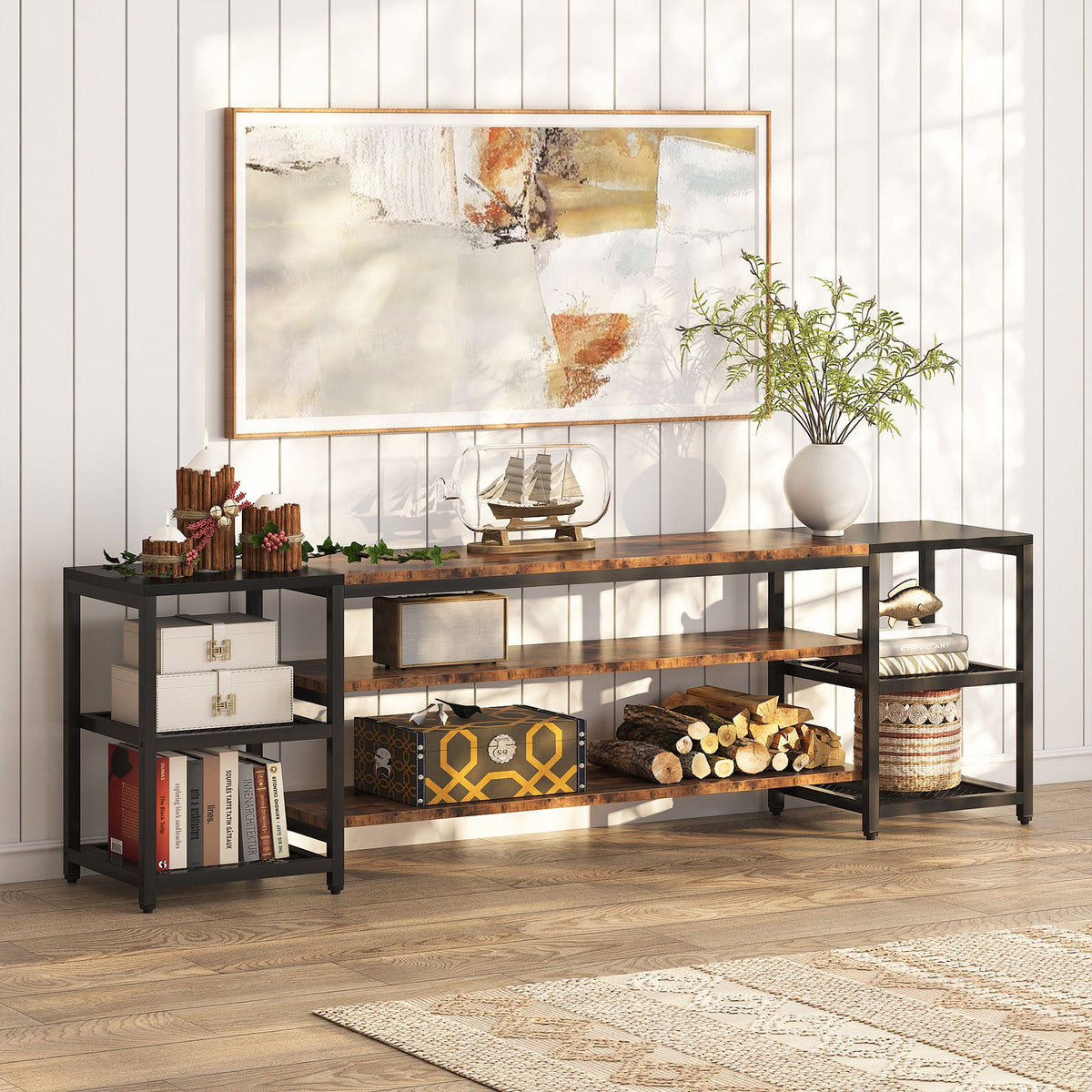 3 tier media entertainment center styled with books and baskets against a panel wall