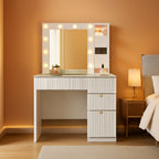 Stowena 36 inch white vanity desk with lit LED mirror and gold handles in a bedroom