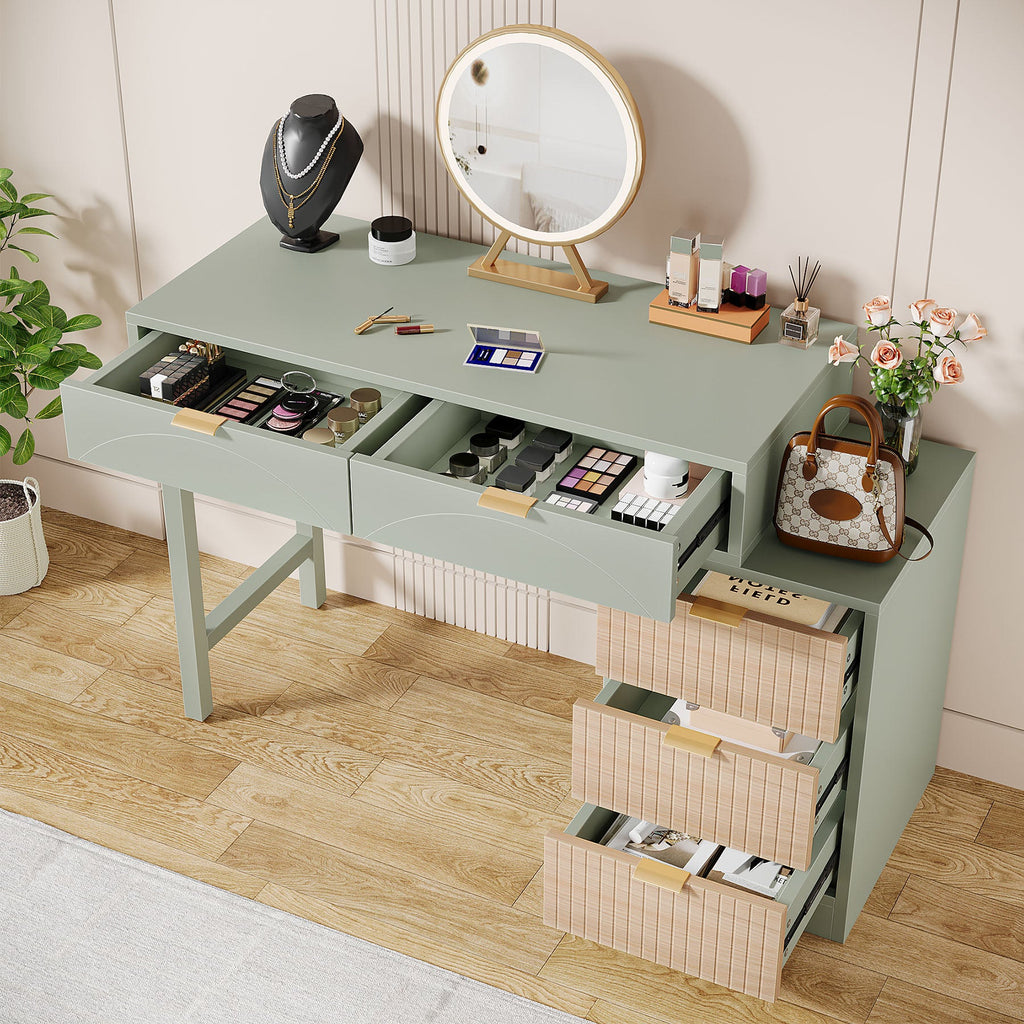 Top drawers open with cosmetics organized inside the mint vanity