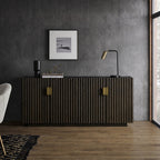 Sloane fluted sideboard styled in a living room with framed art and brass lamp